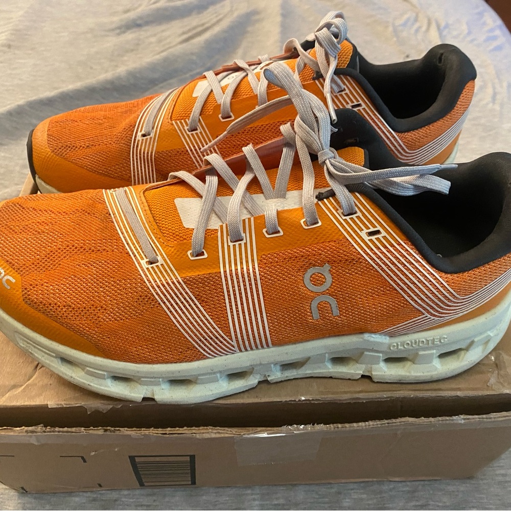 On Running Orange and White Sneakers